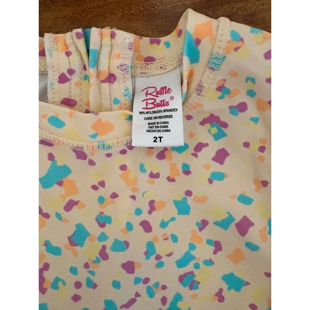 RuffleButts Long Sleeve Rash Guard Swimsuit, Confetti Beach, Size 2T